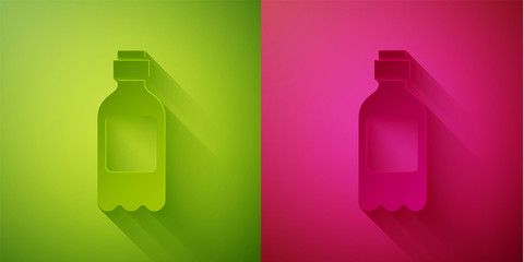 Paper cut Bottle of water icon isolated on green and pink background. Soda aqua drink sign. Paper art style. Vector Illustration
