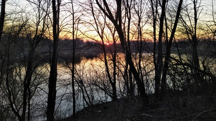 Lake at sunset in rural countryside at spring