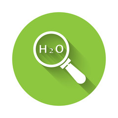 White Chemical formula for water drops H2O shaped icon isolated with long shadow. Green circle button. Vector Illustration