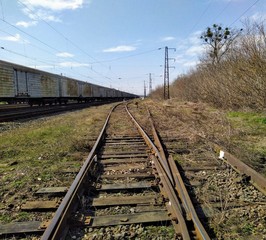 Fototapeta na wymiar Railroad in rural countryside at sunny spring day