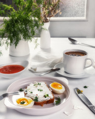 Breakfast with a cup of coffee. Open sandwich with cottage cheese and boiled eggs on a light plate. Above view - 347757418