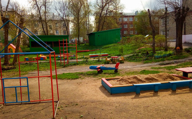 Fototapeta na wymiar Colorful children Playground in the yard of the kindergarten