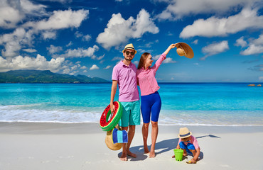 Family with three year old boy on beach. Seychelles, Mahe.
