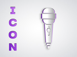 Paper cut Microphone icon isolated on grey background. On air radio mic microphone. Speaker sign. Paper art style. Vector Illustration