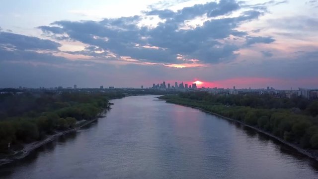 Breath taking, epic 4k drone view over the river durning sunset.