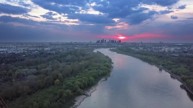 Breath taking, epic 4k drone view over the river durning sunset. At the end there is a beautiful bridge.