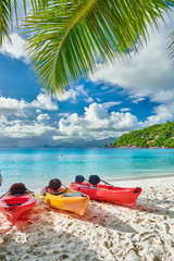 Fototapeta na wymiar Beach with kayaks and palm tree at Seychelles