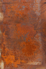 Orange red old rusty metal surface. An oxidized weathered patina with a copper color, texture and structure. Vintage material effect