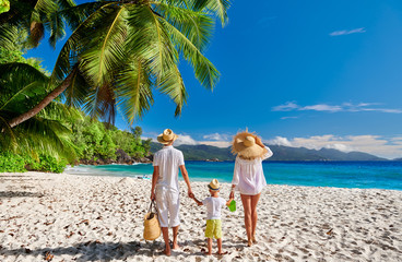 Family with three year old boy on beach. Seychelles, Mahe. - 347768275