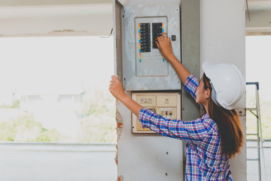 Engineer Checking Breaker Box At Construction Site.