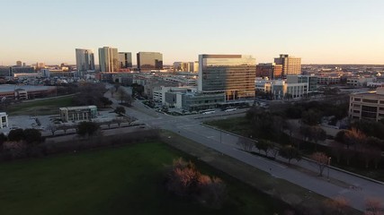 Moving drone shot of the Renaissance Hotel during sunrise in Plano, TX.