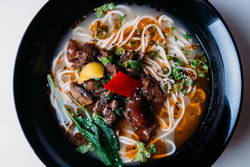 Chinese noodle soup with meat and vegetables