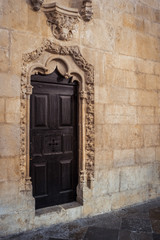 Fototapeta na wymiar Jeronimos Monastery historic old wooden doors indoors, Lisbon, Portugal