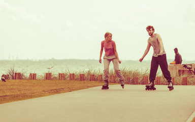 roller skater couple skating outdoor