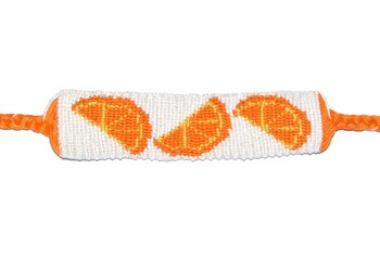 Woven friendship bracelet handmade of thread with orange fruit pattern isolated on white backgroud