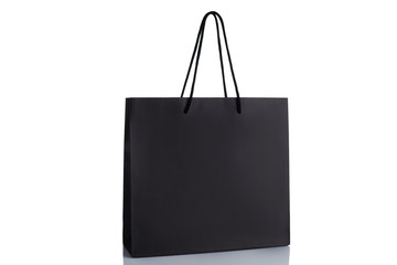 black paper shopping bag isolated on white background. Mockup for design. sale concept.
