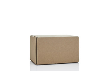 Closed cardboard box isolated on white background