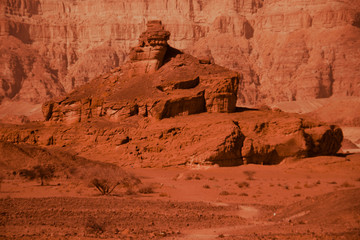 Timna park, Israel - December, 2019. Desert landscape near Eilat with rock on a sunny cloudless day...