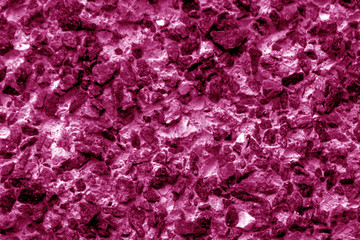 Old stone surface in pink tone.