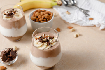 Chia seeds pudding with chocolate and banana smoothie in a glass
