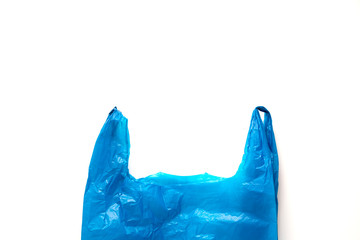 Waste concept. Blue empty plastic bag isolated on white background