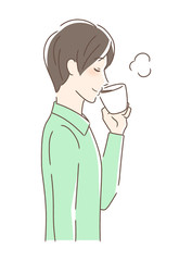 マグカップのコーヒーを飲む男性の横顔