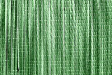 Straw mat texture in green tone.