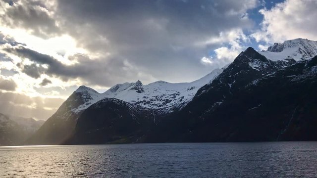 Beautiful Hj&oslash;rundfjord in Norway view towards Sk&aring;r. Video from ferry to Sk&aring;r. Snow covered mountains and beautiful fjord.