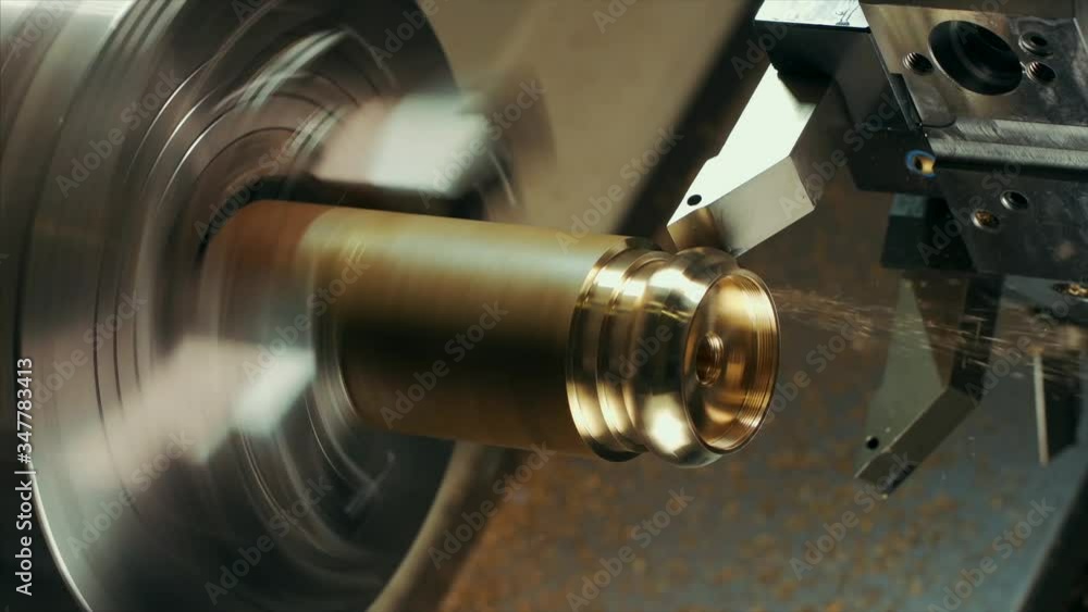 Poster man is shaping copper in cnc machine.