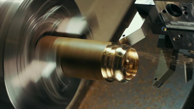 man is shaping copper in cnc machine.