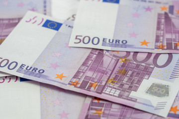 Banknotes of five hundred and 500 euros are scattered in a chaotic manner. European currency blank for design, background. Side view.