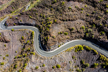 A unique road among high mountains in a beautiful mood of nature