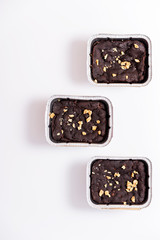 Top of view of homemade chocolate brownie with white backdrop.