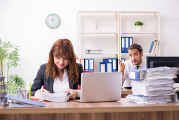 Two employees working in the office