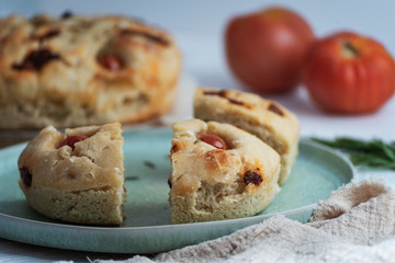 Italian bread with rosemary, dried tomatoes, cherry tomatoes and oil. Homemade bread.