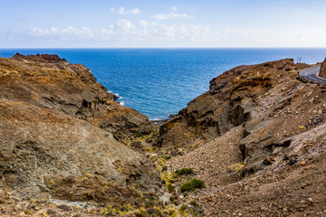 A unique road among high mountains in a beautiful mood of nature