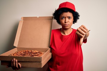 Young African American afro delivery woman with curly hair holding box with Italian pizza with...