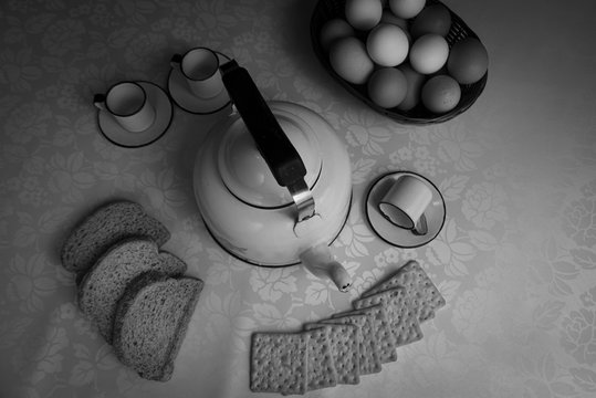 A table arrangement with, teapot, breads and cookies
