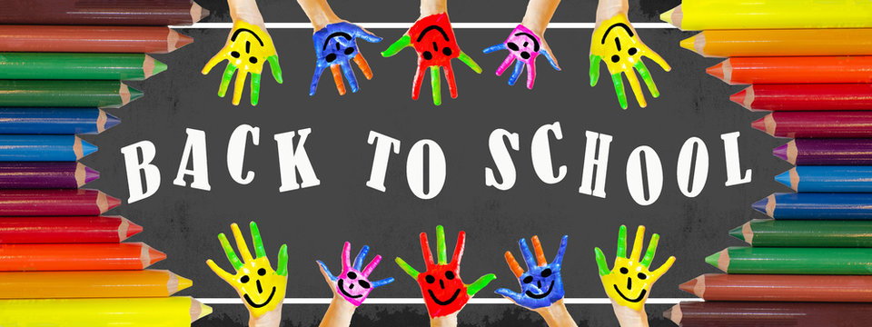 
Back to school background banner panorama - many brightly painted children's hands with smileys and colored wooden crayons isolated on black school board with white lettering