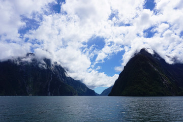 Clouds above the mountains of the fjord