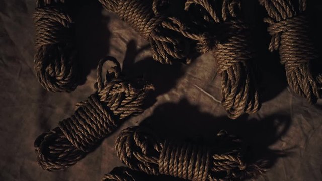 Dominant man ties up a sexy shibari girl,