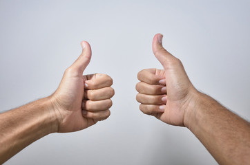 hands giving like on white background