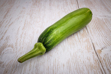 Green raw zucchini with background