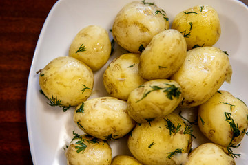 young boiled potatoes on a platter. Delicious homemade vegetable lunch