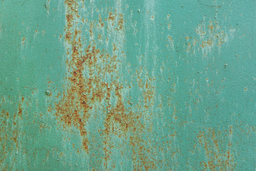 abstract background of an old turquoise rusty metal surface close up