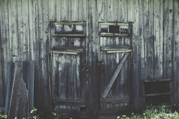 Old dirty rustic grunge farm country house or shed locked doors