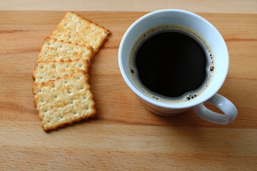 coffee Cup with cookies on a wooden background