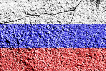 Russian Federation flag on cracked concrete wall. The concept of crisis, default, economic...