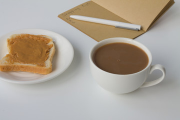 Healthy breakfast, coffee and bread with peanut butter