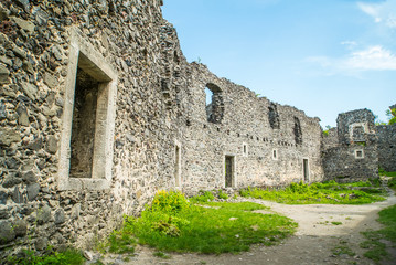 the ruins of an old castle overgrown with grass. Nevytskyi castle Uzhhorod.